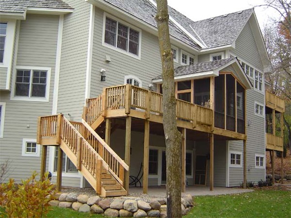 Multi-level cedar deck and screened porch on a walkout